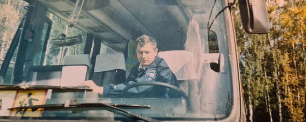 Водитель олимпийских автобусов Николай Юганов. Архивное фото Водитель олимпийских автобусов Николай Юганов. Архивное фото - Sputnik Латвия