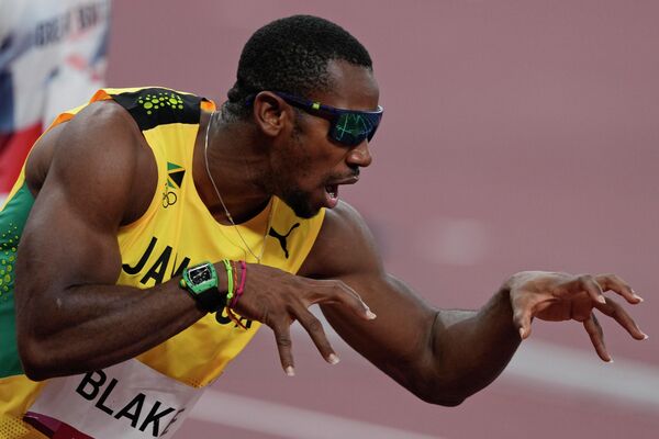 Йохан Блейк с Ямайки перед стартом в полуфинальном забеге на 100 метров - Sputnik Латвия