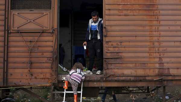 Беженцы в вагоне поезда - Sputnik Латвия