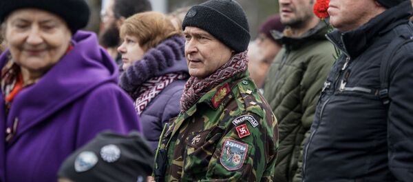 Руководитель национал-патриотической организации Центр Густава Целминьша Игорь Шишкинс. Запрещенная символика на шествии легионеров16 марта 2019 в Риге Руководитель национал-патриотической организации Центр Густава Целминьша Игорь Шишкинс. Запрещенная символика на шествии легионеров16 марта 2019 в Риге - Sputnik Latvija