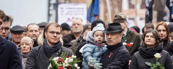 Депутат Сейма от Национального объединения Райвис Дзинтарс на шествии легионеров в Риге 16 марта 2019 Депутат Сейма от Национального объединения Райвис Дзинтарс на шествии легионеров в Риге 16 марта 2019 - Sputnik Latvija
