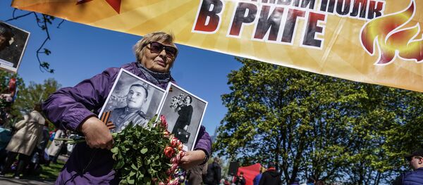 Акция Бессмертный полк в Риге, 9 мая 2019 Акция Бессмертный полк в Риге, 9 мая 2019 - Sputnik Латвия