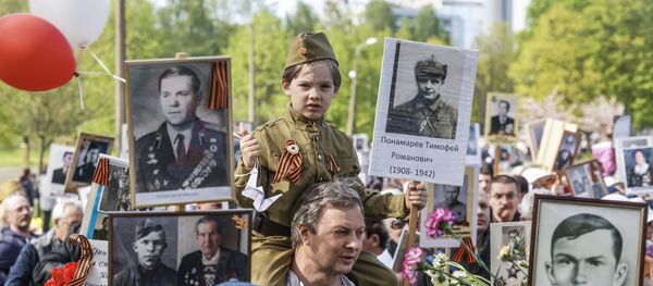 Акция Бессмертный полк в Риге, 9 мая 2019 Акция Бессмертный полк в Риге, 9 мая 2019 - Sputnik Latvija