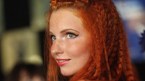 Участница конкурса красоты Мисс бикини во время показа в Таллине. - Sputnik Латвия