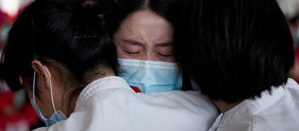 Медицинские работники в международном аэропорту Ухань-Тяньхэ, Китай Медицинские работники в международном аэропорту Ухань-Тяньхэ, Китай - Sputnik Латвия
