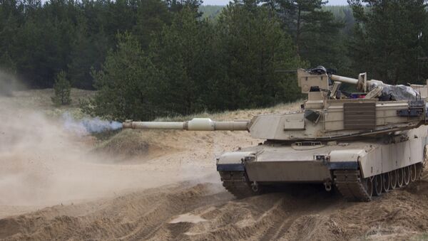 Танк M1A2 Abrams на военном полигоне Адажи во время учений - Sputnik Latvija