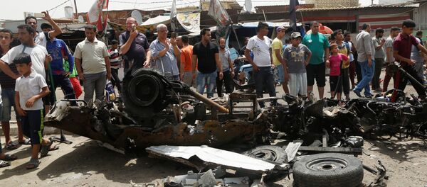 На месте взрыва бомбы в Багдаде На месте взрыва бомбы в Багдаде - Sputnik Латвия