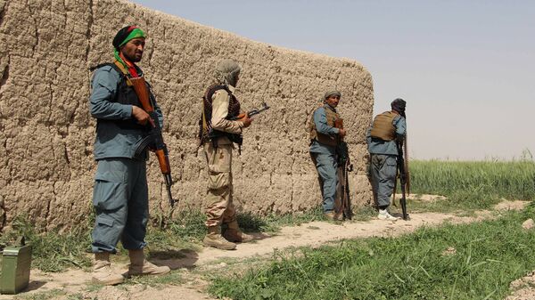 Полицейские Афганистана во время боя с талибами в Нахри-Сарадж провинции Гильменд, Афганистан - Sputnik Latvija