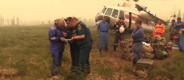 Операция по поиску пропавшего в Иркутской области Ил-76. Съемка МЧС РФ Операция по поиску пропавшего в Иркутской области Ил-76. Съемка МЧС РФ - Sputnik Латвия