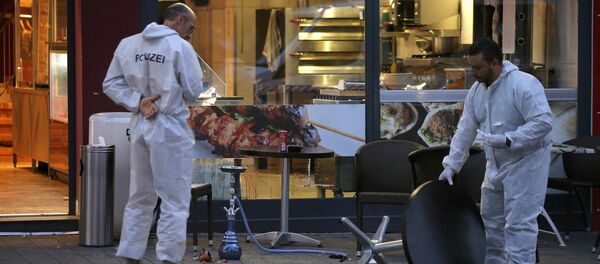 На месте нападения беженца с мачете в Ройтлингене, Германия - Sputnik Латвия