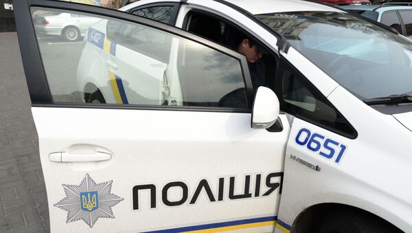 Сотрудник украинской полиции в Киеве - Sputnik Латвия