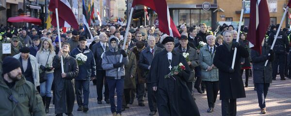 Участники шествия легионеров в Риге Участники шествия легионеров в Риге - Sputnik Latvija