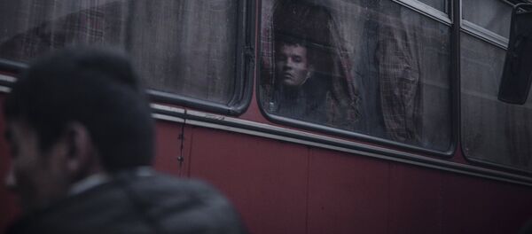 Беженцы в автобусе - Sputnik Латвия