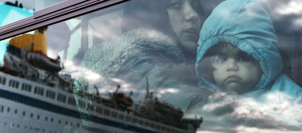 Bēgļi autobusā. Foto no arhīva Bēgļi autobusā. Foto no arhīva - Sputnik Latvija