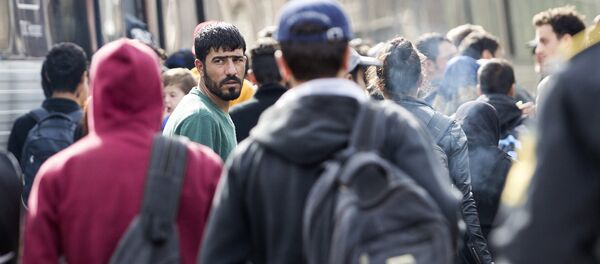 Беженцы на вокзале в Дании Беженцы на вокзале в Дании - Sputnik Latvija