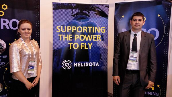 Представители литовской фирмы Helisota Видманте Грималаускаите и Ауримас Ясинскис Представители литовской фирмы Helisota Видманте Грималаускаите и Ауримас Ясинскис - Sputnik Латвия