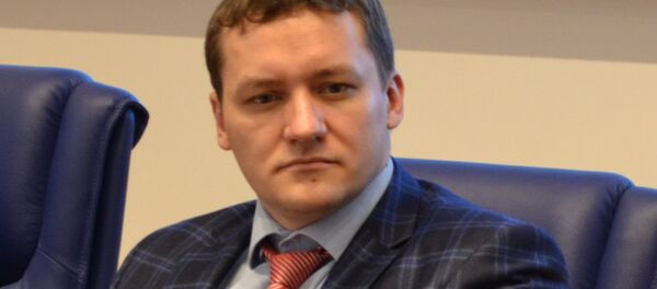 Белорусский экономист Дмитрий Болкунец Белорусский экономист Дмитрий Болкунец - Sputnik Латвия