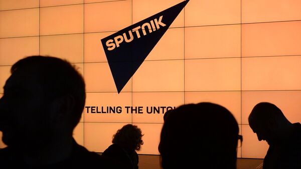 Логотип международного информационного бренда Sputnik - Sputnik Latvija