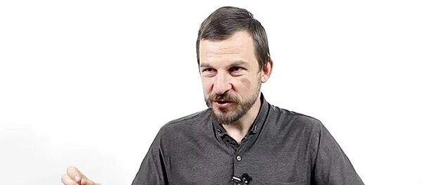 Доцент Международного института экономики и финансов Алексей Белянин Доцент Международного института экономики и финансов Алексей Белянин - Sputnik Латвия