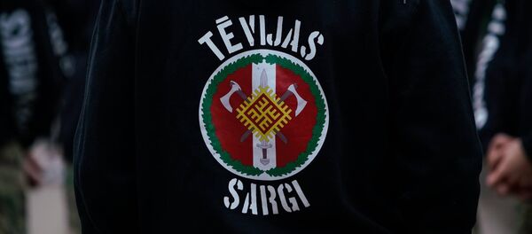 Члены радикальной националистической группировки Tēvijas sargi (Стражи Отечества) Члены радикальной националистической группировки Tēvijas sargi (Стражи Отечества) - Sputnik Latvija