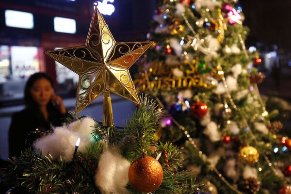Christmas decoration items are displayed for sale at a shop in Hanoi, Vietnam - Sputnik Latvija