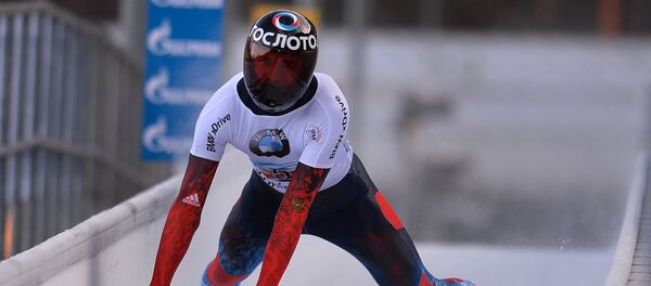 Александр Третьяков (Россия) на финише в соревновании по скелетону среди мужчин - Sputnik Латвия
