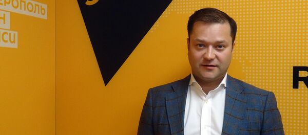 Директор Института актуальной экономики Никита Исаев - Sputnik Латвия