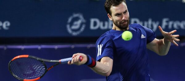 Латвиец Эрнестс Гулбис в матче против француза Люки Пуя в Дубае 27 февраля 2018 года - Sputnik Латвия