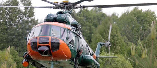 Вертолет Национальных вооруженных сил Латвии участвует в тушении пожара под Талси - Sputnik Латвия