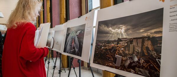 Andreja Steņina fotožurnālistikas konkursa finālistu darbu izstāde Andreja Steņina fotožurnālistikas konkursa finālistu darbu izstāde - Sputnik Latvija